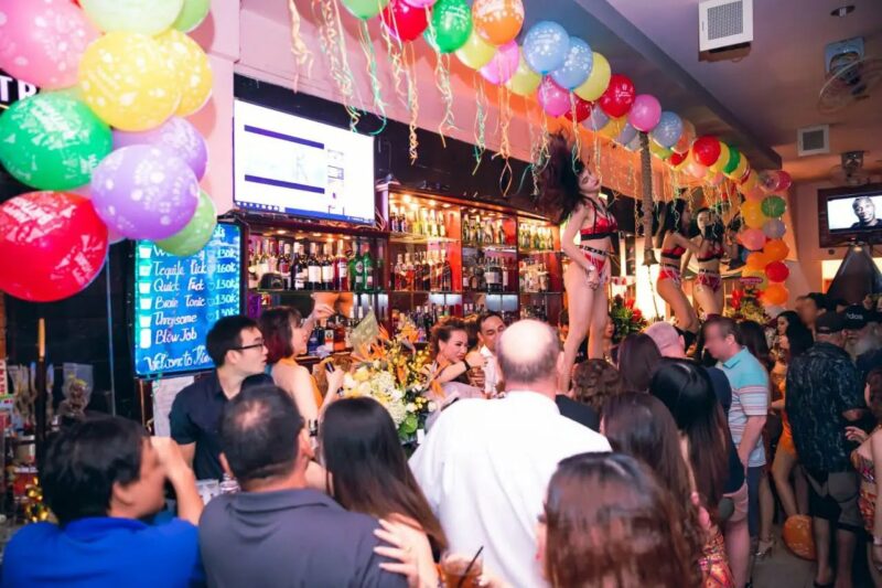 About 5 girl-dancing-onbar-with-everyone-watching
