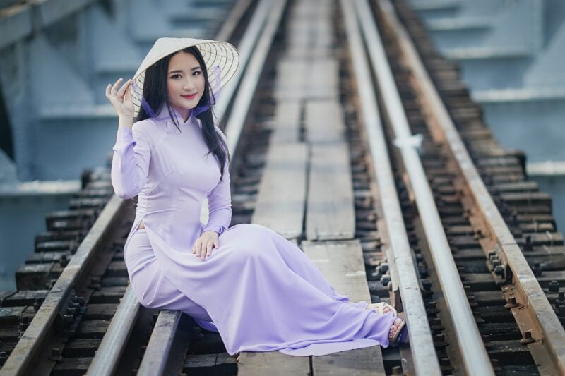 Traditional vietnamese girl wearing vietnamese dress and hat