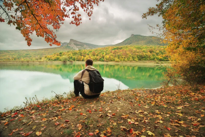 In a LDR? Learn What Kills Long-Distance Relationships And How To Fix It! 2 Man sitting alone with his thoughts and not sharing his experiences has a big impact on LDR