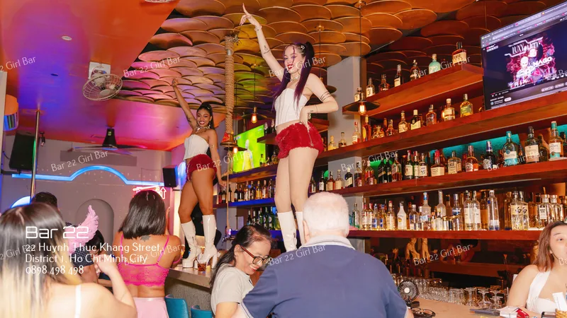 Strip Clubs in Ho Chi Minh City: What Travelers Should Know 2 Girl dancing on the bar at Bar 22 similar to a strip club
