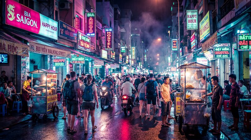 Bui Vien Walking Street at night neon signs busy crowds